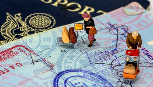 U.S. passport and visa documents representing EB-2 NIW and EB-1A immigration pathways